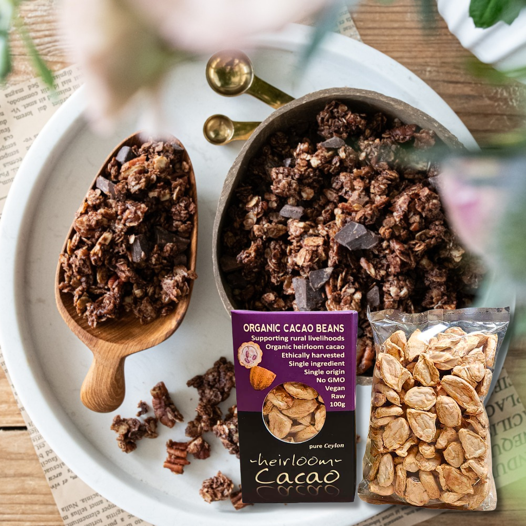 Ceylon Kokonati Organic Raw Cacao Beans — box and clear pouch beside a bowl of chocolate granola on a white tray
